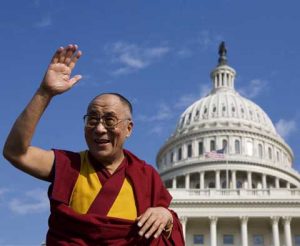 The Dalai Lama greets supporters before the Capitol dome during festivities honouring him 17 October 2007 in Washington, DC. A Nobel Peace Prize laureate, the 72-year-old Tibetan spiritual leader received the highest honor that can be bestowed by the US Congress, the Congressional Gold Medal, during a lavish ceremony in the Capitol's rotunda, despite knowing it would anger China. AFP PHOTO/Mandel NGAN